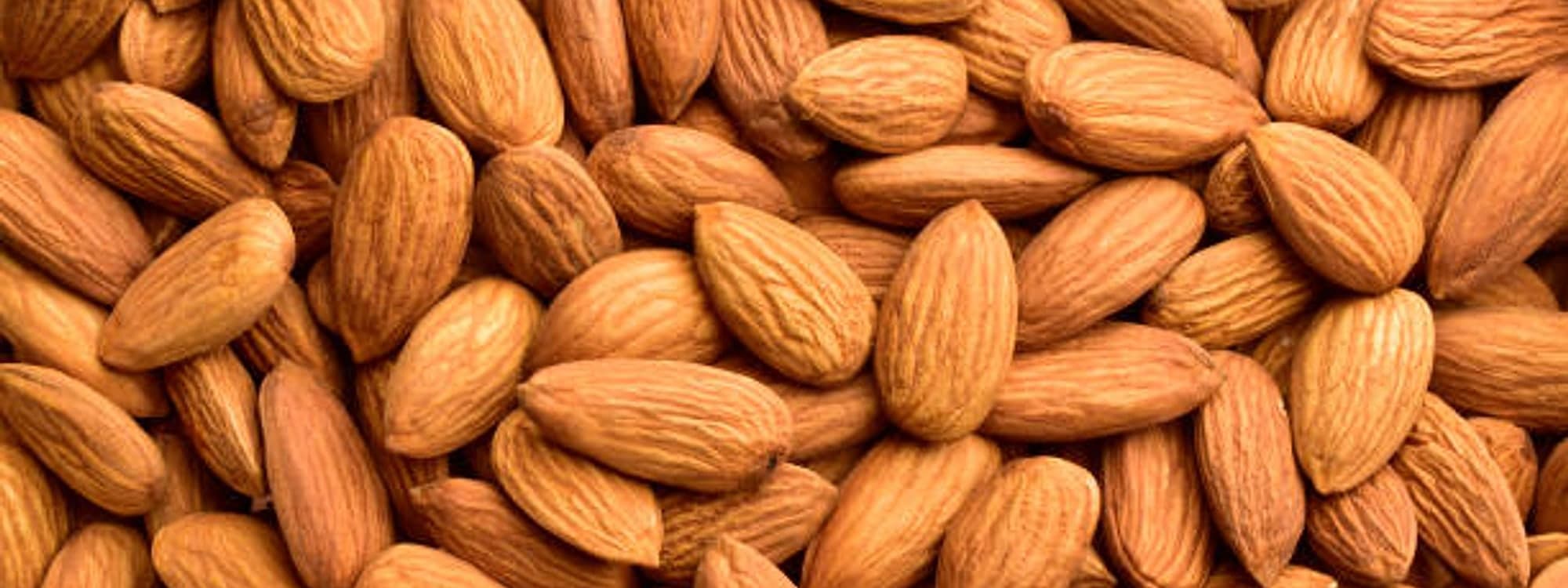 A close-up of whole raw almonds
