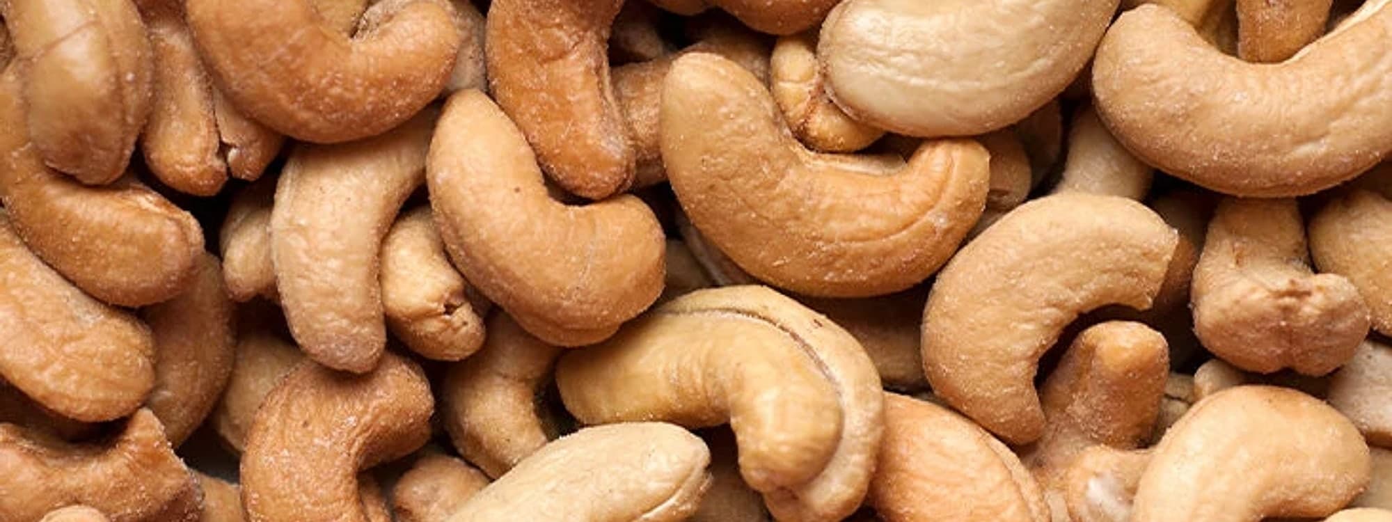 A close-up of whole cashews